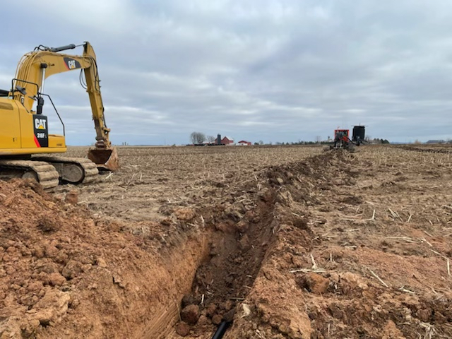 Excavator working in a field